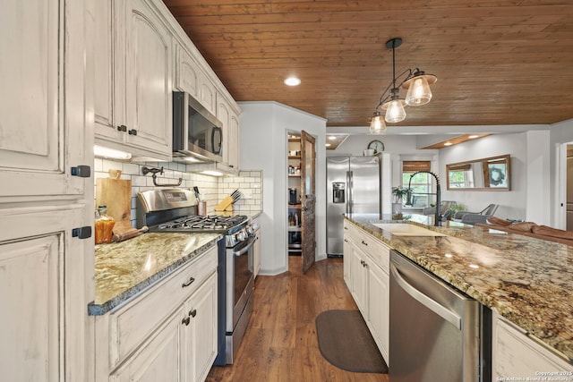 14834 Fm 536, Pleasanton, TX 78064 - kitchen with stainless steel appliances, a sink, wood ceiling, tasteful backsplash, and dark wood-style flooring