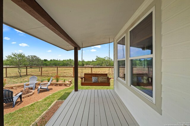 14834 Fm 536, Pleasanton, TX 78064 - wooden terrace with a fire pit