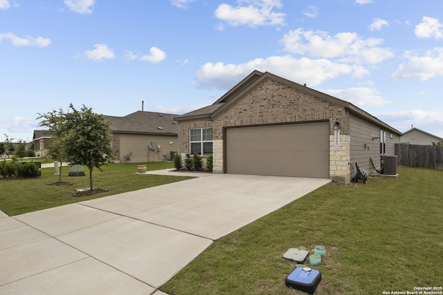 31665 Acacia Vis, Bulverde, TX 78163 - view of front of house featuring a garage, driveway, central AC, and brick siding