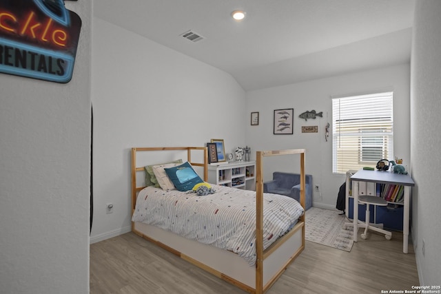 31665 Acacia Vis, Bulverde, TX 78163 - bedroom with wood finished floors, vaulted ceiling, and baseboards