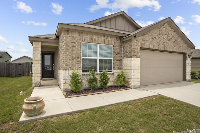 31665 Acacia Vis, Bulverde, TX 78163 - view of front facade with board and batten siding, an attached garage, concrete driveway, stone siding, and brick siding