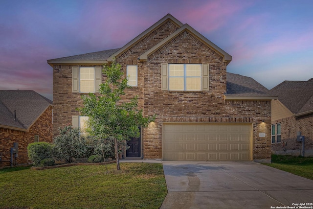 13908 Lazada, San Antonio, TX 78245 - traditional-style house with driveway, brick siding, a front yard, and roof with shingles