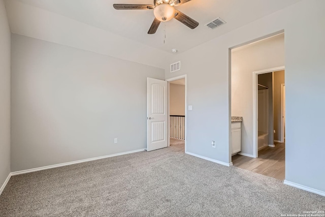 13908 Lazada, San Antonio, TX 78245 - unfurnished bedroom with light carpet, baseboards, ensuite bathroom, and a ceiling fan