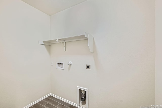 13908 Lazada, San Antonio, TX 78245 - laundry area with gas dryer hookup, hookup for an electric dryer, baseboards, hookup for a washing machine, and dark wood-style flooring