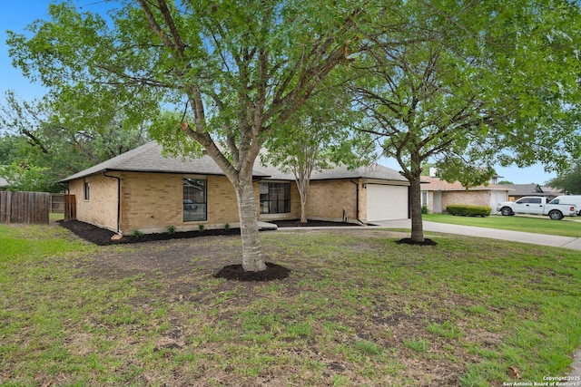 7527 Rustic Trl, San Antonio, TX 78244 - view of front facade featuring concrete driveway, brick siding, an attached garage, and roof with shingles