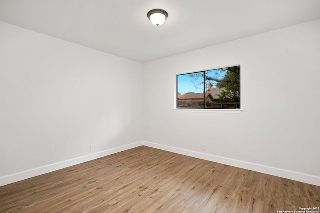 7527 Rustic Trl, San Antonio, TX 78244 - spare room with baseboards and wood finished floors