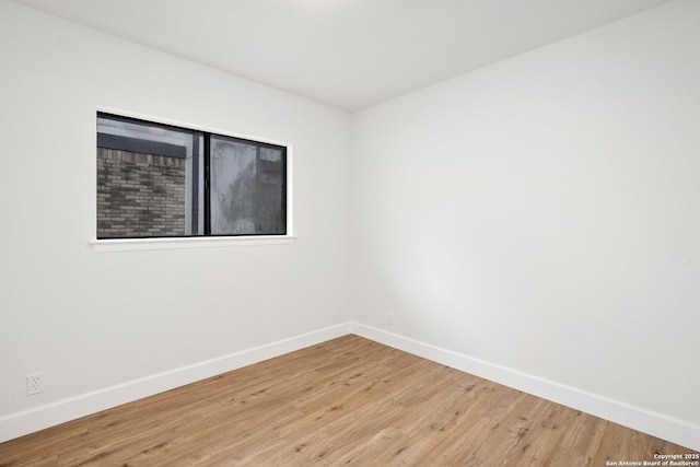 7527 Rustic Trl, San Antonio, TX 78244 - empty room featuring baseboards and light wood-type flooring