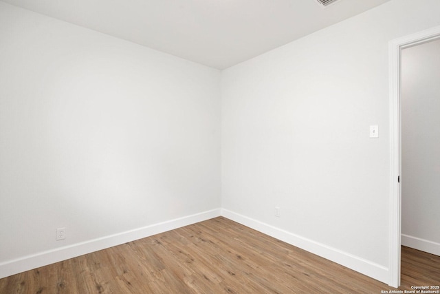 7527 Rustic Trl, San Antonio, TX 78244 - empty room featuring baseboards and light wood-type flooring