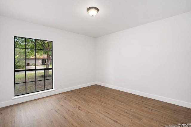 7527 Rustic Trl, San Antonio, TX 78244 - empty room with baseboards and wood finished floors