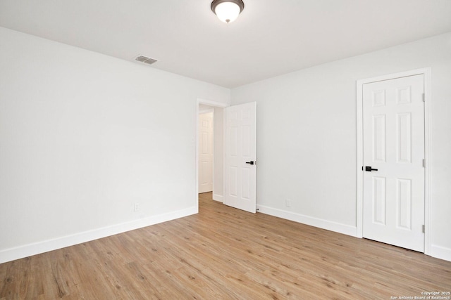 7527 Rustic Trl, San Antonio, TX 78244 - unfurnished bedroom with light wood-type flooring and baseboards