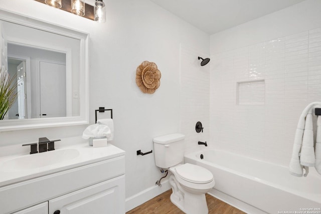 7527 Rustic Trl, San Antonio, TX 78244 - full bath featuring toilet, vanity, wood finished floors, tub / shower combination, and baseboards
