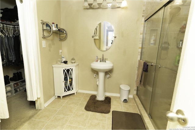 3322 Dunlap Flds, Converse, TX 78109 - full bathroom with a spacious closet, a stall shower, and tile patterned flooring