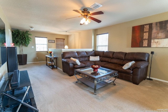 3322 Dunlap Flds, Converse, TX 78109 - living area featuring a ceiling fan, light carpet, and baseboards