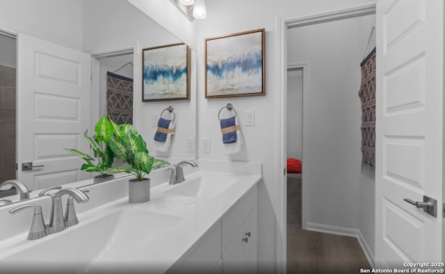 6422 Penny Path, San Antonio, TX 78253 - full bath with double vanity, wood finished floors, and baseboards