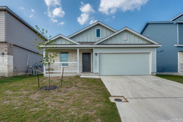 10827 Hernando Ct, Converse, TX 78109 - view of front of property featuring board and batten siding, covered porch, driveway, an attached garage, and a front lawn