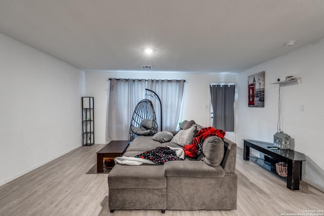 10827 Hernando Ct, Converse, TX 78109 - living room with light wood-type flooring and baseboards