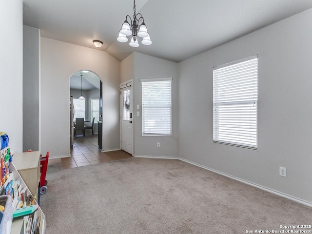 6211 Post Mi, San Antonio, TX 78244 - entryway with arched walkways, carpet flooring, a chandelier, lofted ceiling, and baseboards