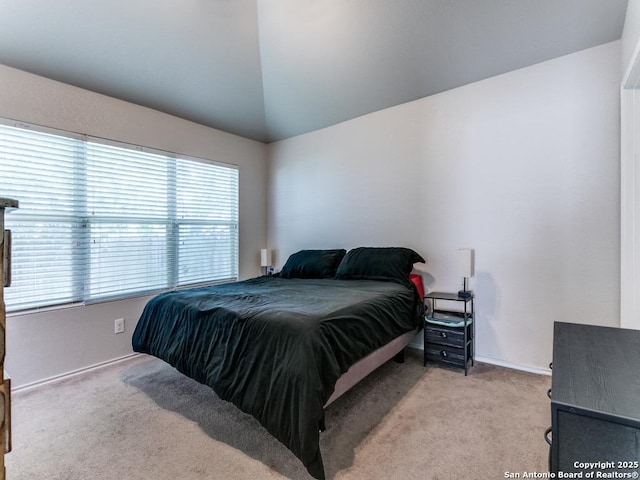 6211 Post Mi, San Antonio, TX 78244 - bedroom with light colored carpet, vaulted ceiling, and baseboards