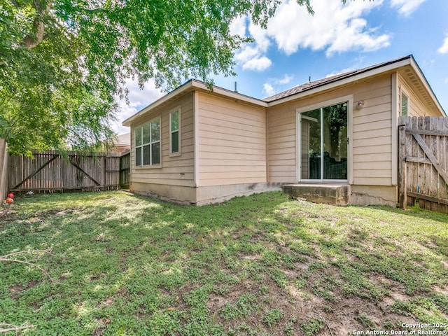 6211 Post Mi, San Antonio, TX 78244 - rear view of house featuring a gate