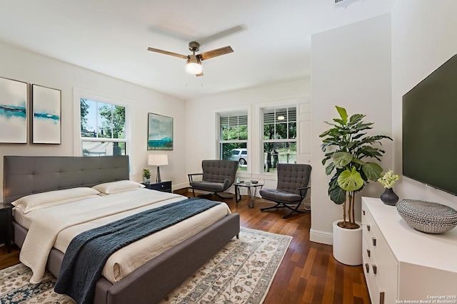 515 Westfall Ave, San Antonio, TX 78210 - bedroom featuring baseboards, dark wood-style flooring, and ceiling fan