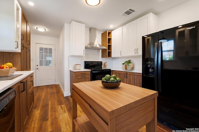 515 Westfall Ave, San Antonio, TX 78210 - kitchen with black appliances, wall chimney range hood, light countertops, open shelves, and backsplash
