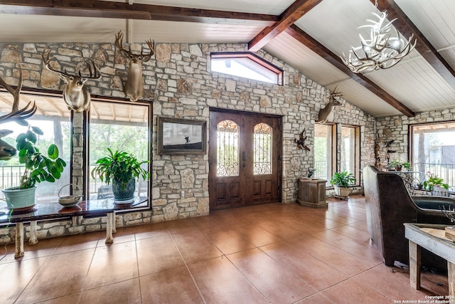 10745 Rosemar Ln, Adkins, TX 78101 - foyer with healthy amount of natural light, a chandelier, french doors, and tile patterned floors