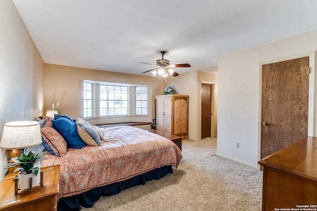 10745 Rosemar Ln, Adkins, TX 78101 - carpeted bedroom with baseboards, a ceiling fan, and a textured wall