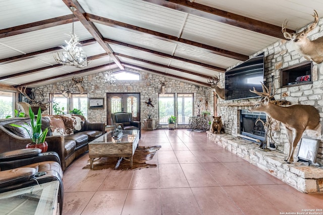 10745 Rosemar Ln, Adkins, TX 78101 - living room featuring a stone fireplace and a chandelier