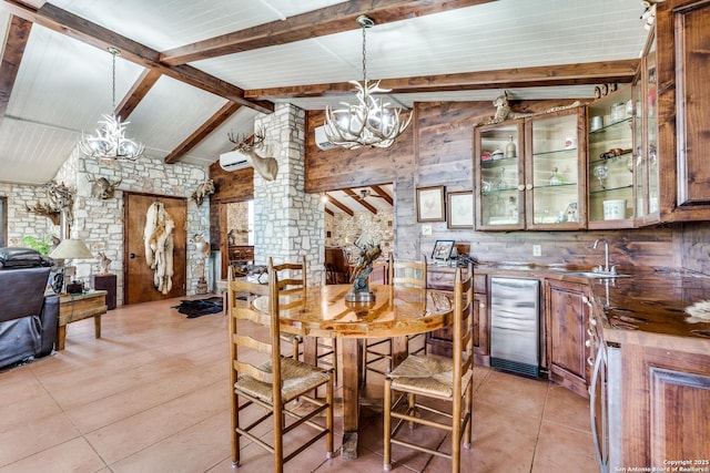 10745 Rosemar Ln, Adkins, TX 78101 - dining room with a chandelier, light tile patterned floors, beverage cooler, and bar
