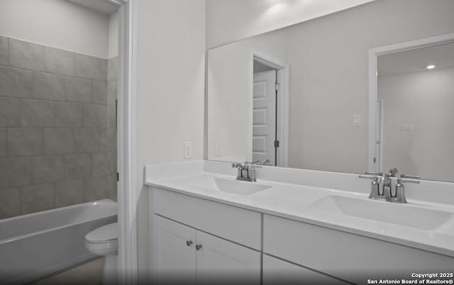 14431 Inspiration Pt, San Antonio, TX 78253 - bathroom with double vanity, toilet, and  shower combination