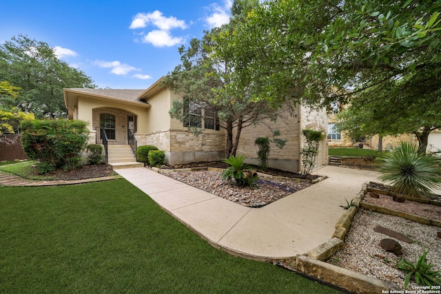 102 Blue Thorn, San Antonio, TX 78256 - view of front of house featuring stone siding, a front yard, and stucco siding