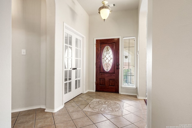 102 Blue Thorn, San Antonio, TX 78256 - foyer entrance featuring light tile patterned floors, baseboards, and french doors