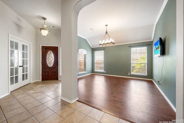 102 Blue Thorn, San Antonio, TX 78256 - entrance foyer with vaulted ceiling, baseboards, crown molding, tile patterned flooring, and a chandelier
