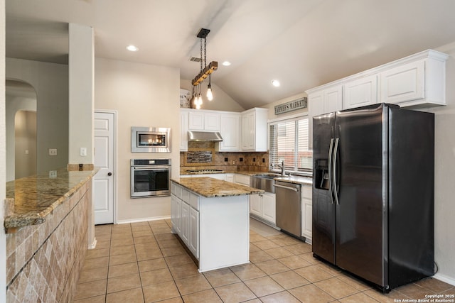 102 Blue Thorn, San Antonio, TX 78256 - kitchen featuring stainless steel appliances, lofted ceiling, a sink, white cabinets, and arched walkways