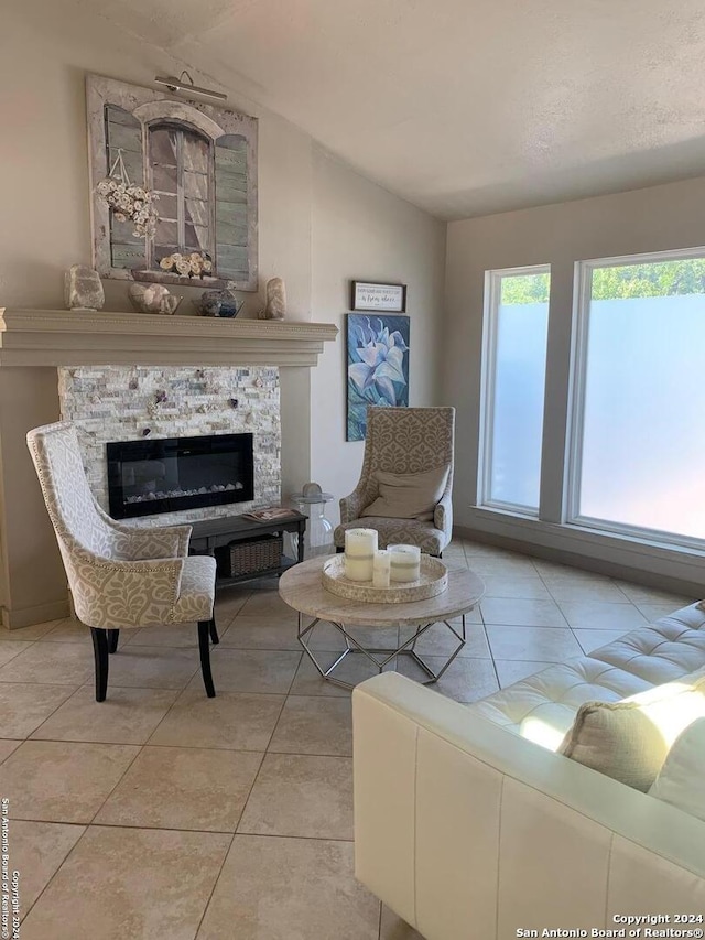 12111 Woodsrim, Live Oak, TX 78233 - living area featuring lofted ceiling, a fireplace, and light tile patterned floors
