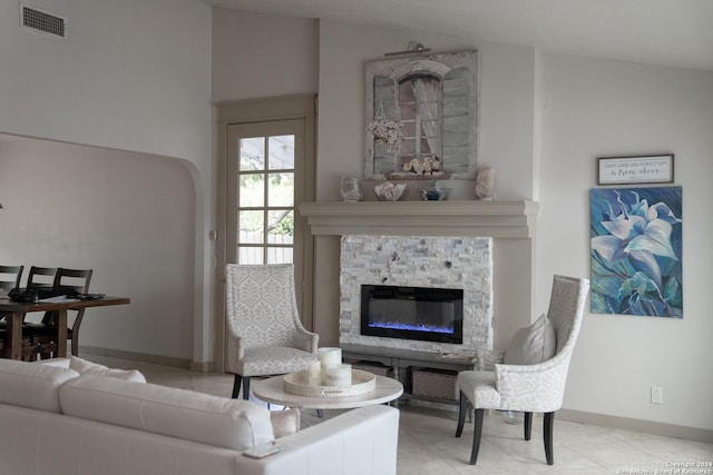 12111 Woodsrim, Live Oak, TX 78233 - living room with a stone fireplace, baseboards, and arched walkways