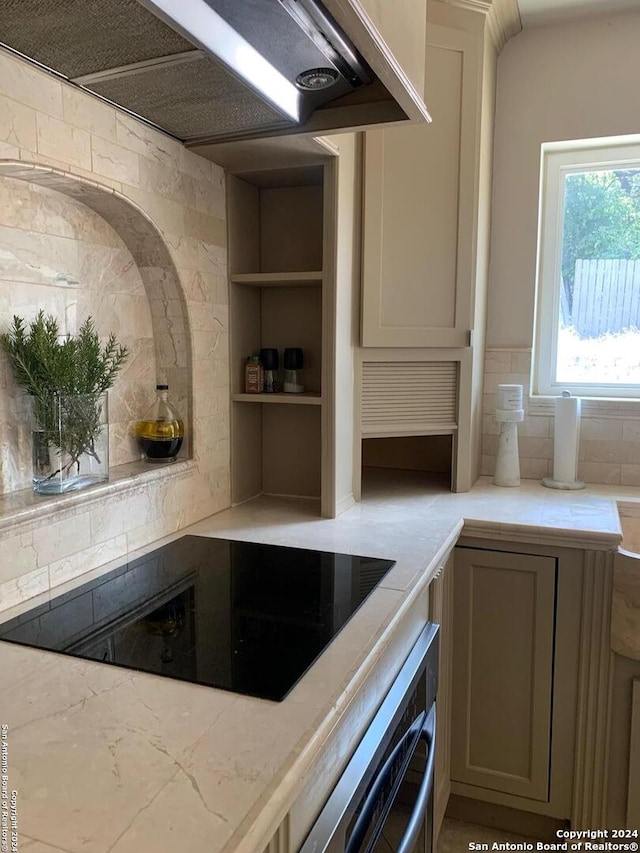 12111 Woodsrim, Live Oak, TX 78233 - kitchen featuring black electric cooktop, ventilation hood, wall oven, and decorative backsplash