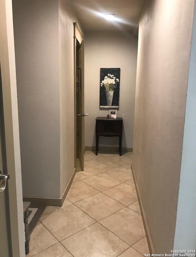 12111 Woodsrim, Live Oak, TX 78233 - hallway with light tile patterned flooring and baseboards
