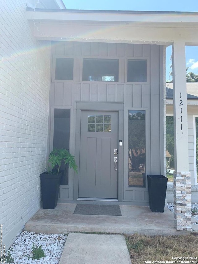 12111 Woodsrim, Live Oak, TX 78233 - property entrance with board and batten siding and brick siding