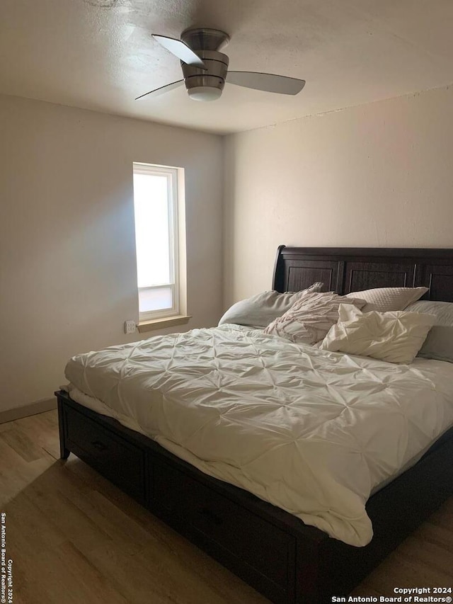 12111 Woodsrim, Live Oak, TX 78233 - bedroom with wood finished floors and ceiling fan