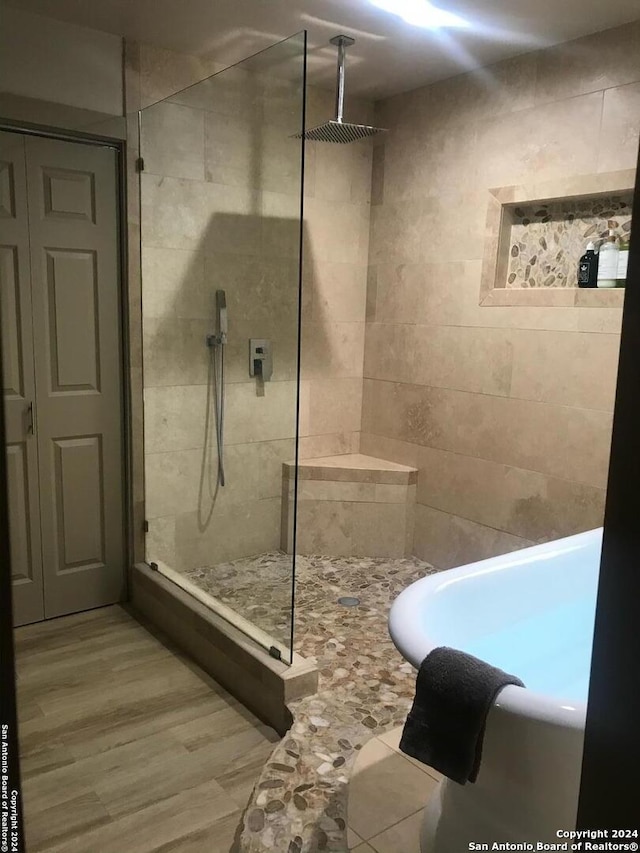 12111 Woodsrim, Live Oak, TX 78233 - bathroom with a walk in shower and wood finished floors