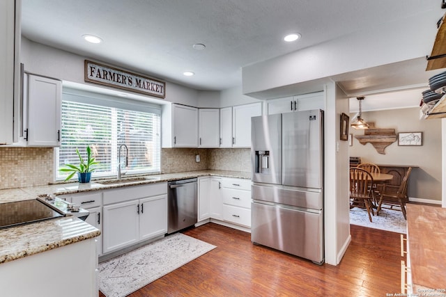 3618 Minthill, San Antonio, TX 78230 - kitchen with stainless steel appliances, a sink, white cabinetry, backsplash, and recessed lighting