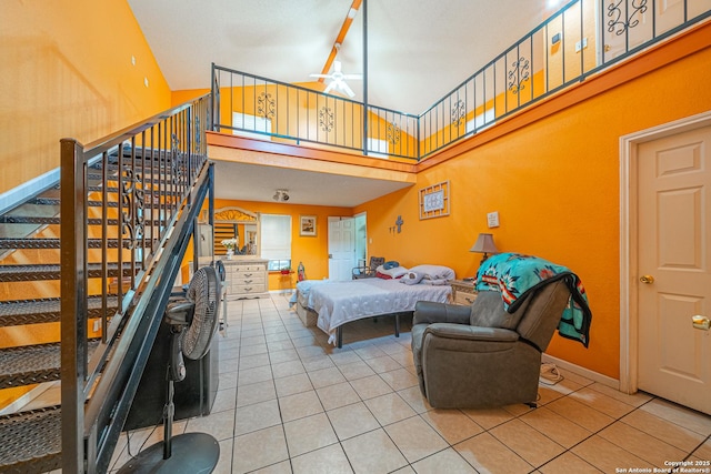 3211 Hatton, San Antonio, TX 78237 - bedroom featuring light tile patterned flooring, a towering ceiling, and baseboards