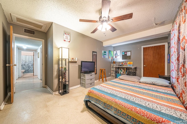 3211 Hatton, San Antonio, TX 78237 - bedroom with attic access, a textured ceiling, baseboards, and ceiling fan