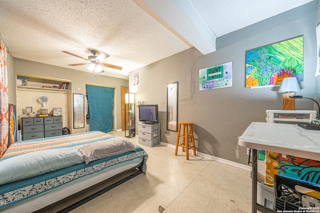 3211 Hatton, San Antonio, TX 78237 - bedroom featuring a textured ceiling, tile patterned floors, baseboards, and a ceiling fan