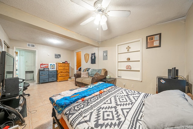 3211 Hatton, San Antonio, TX 78237 - bedroom with a textured ceiling, electric panel, light tile patterned floors, and ceiling fan