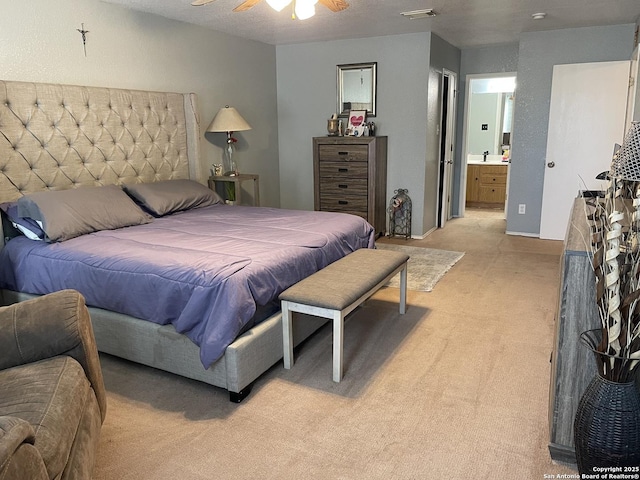 9858 Menard Cir, San Antonio, TX 78245 - bedroom with light carpet and ensuite bath