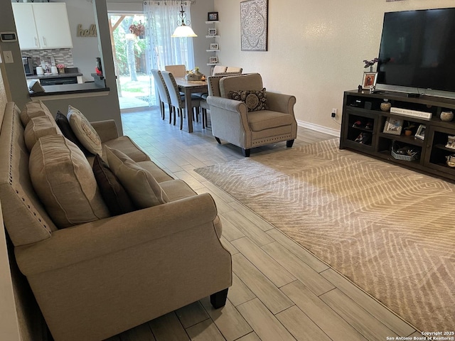 9858 Menard Cir, San Antonio, TX 78245 - living area with wood tiled floors and baseboards
