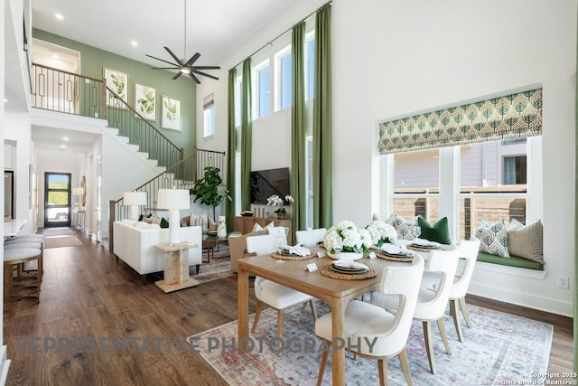 12376 Goulding, San Antonio, TX 78254 - dining area with a high ceiling, stairs, wood finished floors, ceiling fan, and recessed lighting