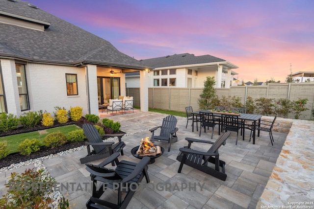12376 Goulding, San Antonio, TX 78254 - fenced backyard with an outdoor fire pit, outdoor dining area, and a patio area
